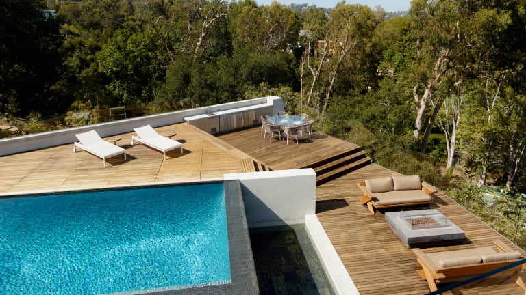 Grass-Covered Roof, Modern Style & Gorgeous Pool Deck: This Home Has It All